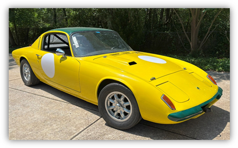 A yellow car parked on concrete

AI-generated content may be incorrect.