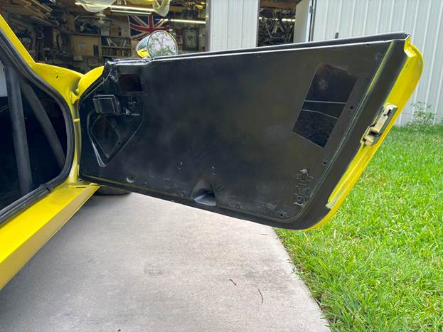 A car door open with a door open

AI-generated content may be incorrect.